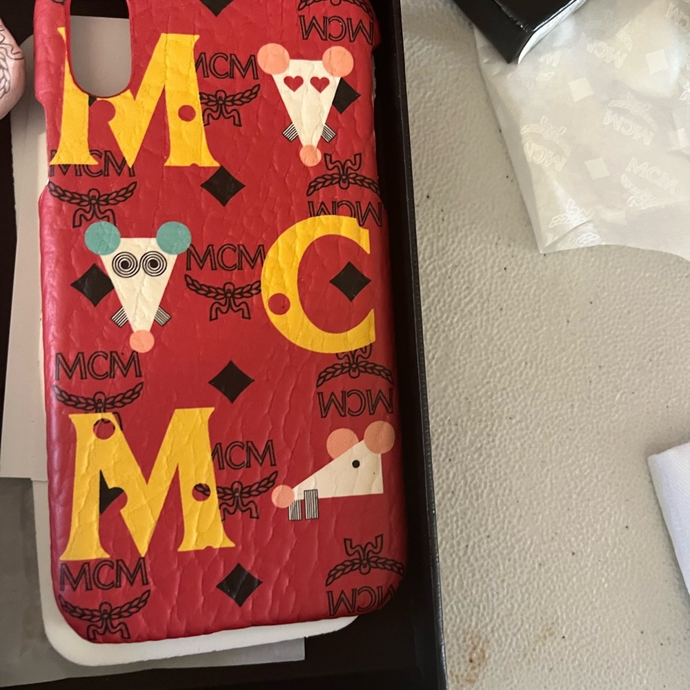 2 authentic MCM iPhone cases in pink and red